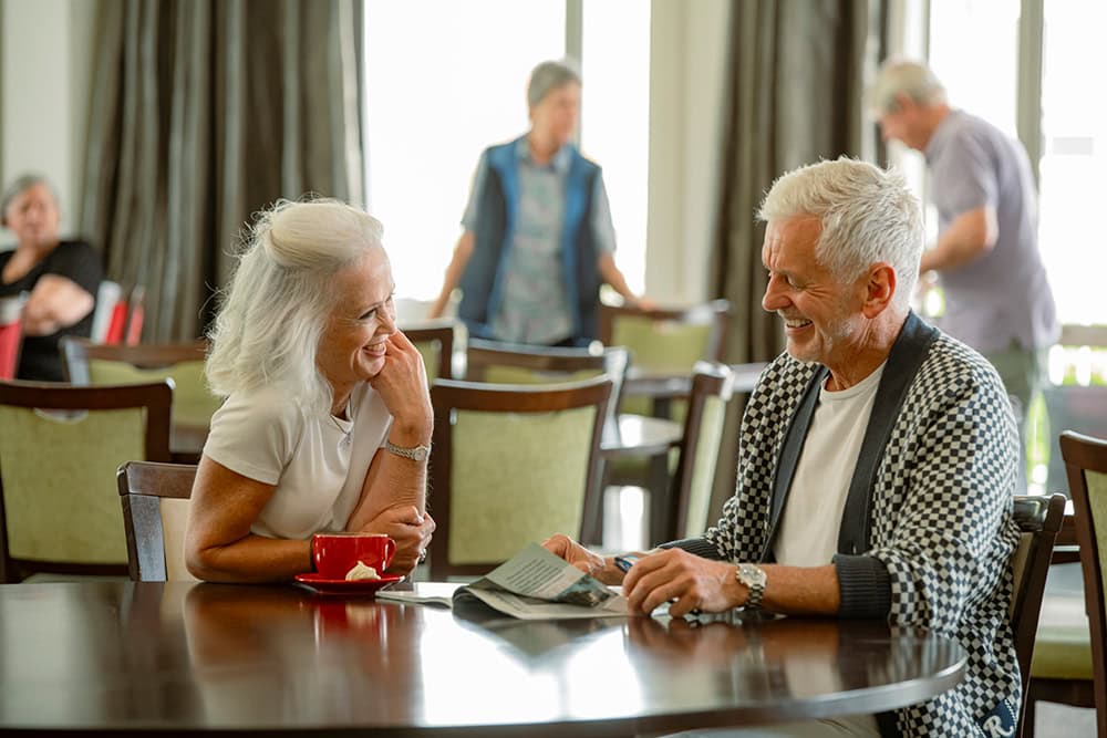 Settlers retirement village residents enjoying a relaxed conversation over coffee A slightly more general option: